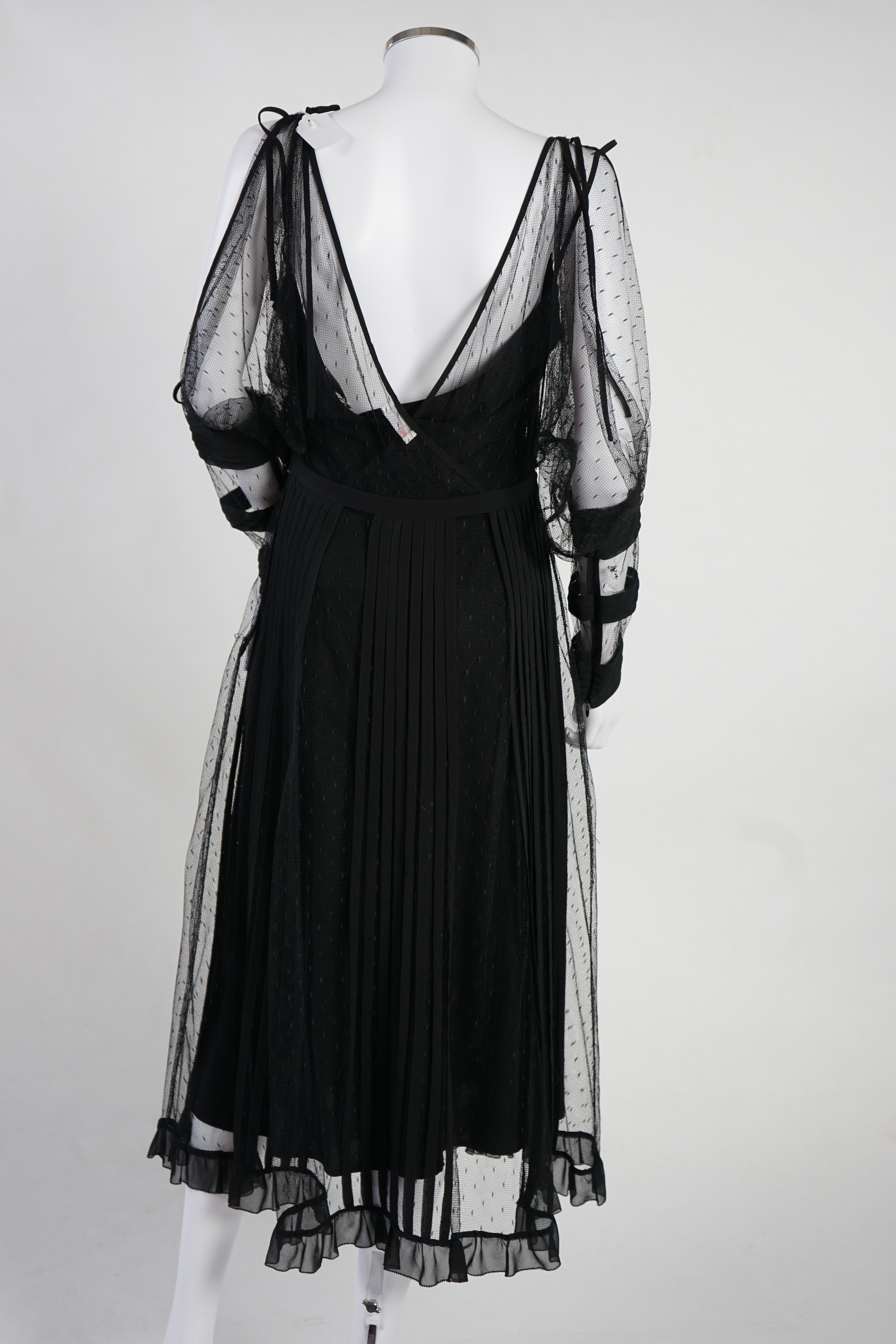 A Red Valentino black lace dress with under slip. Proceeds to Happy Paws Puppy Rescue